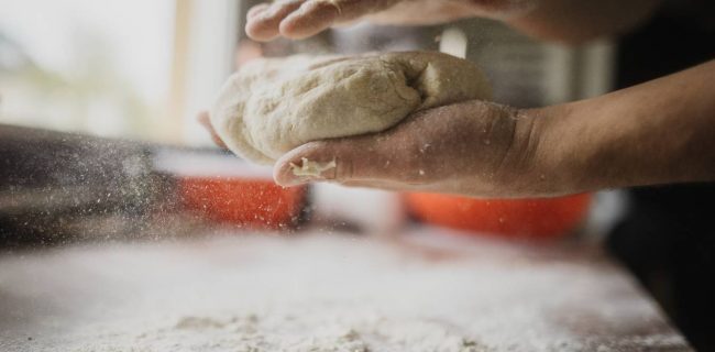 Chef or baker making dough.